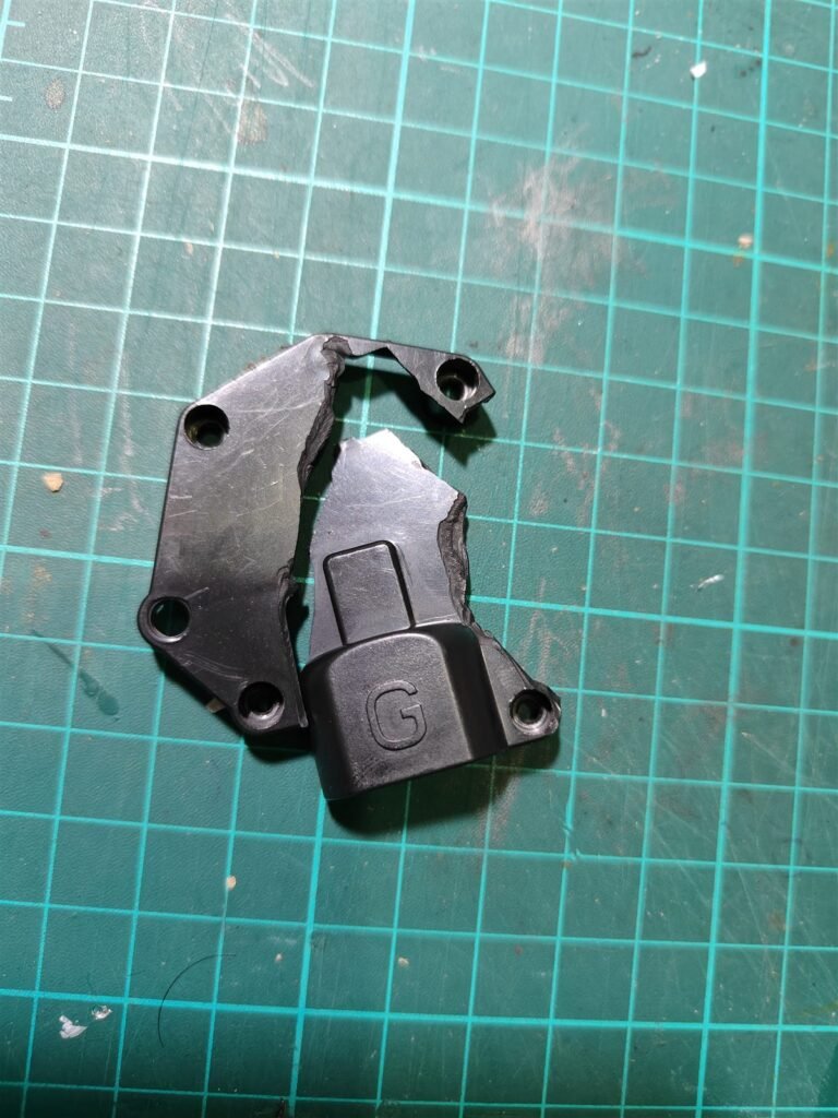 Broken toy car part supplied as reference